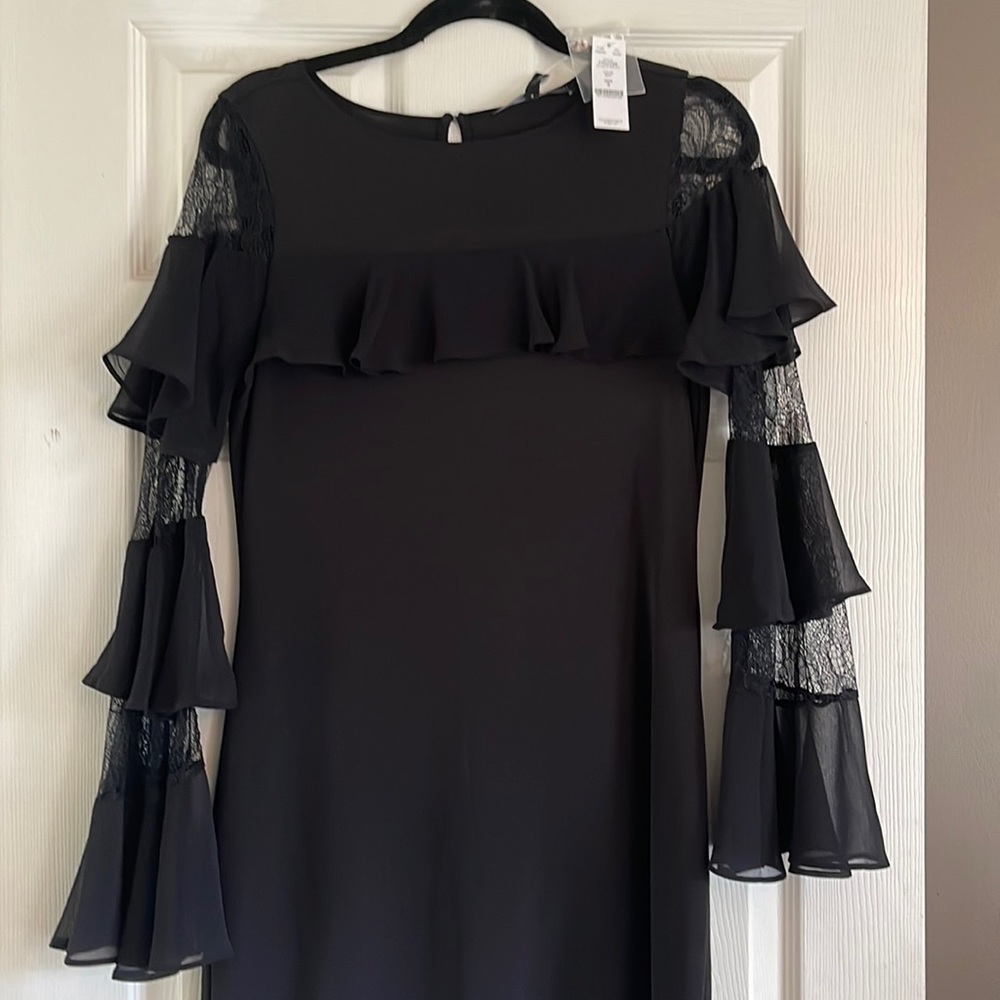 NWT White House black market dress. Fun lace and ruffle sleeves.